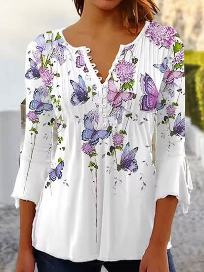 Sommarblus i original - halvlånga ärmar och blommigt mönster