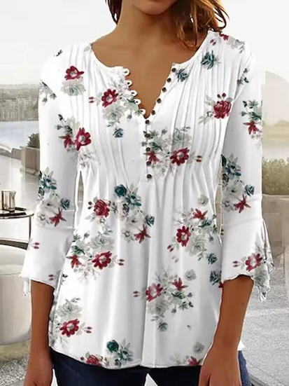 Sommarblus i original - halvlånga ärmar och blommigt mönster